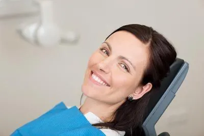woman smiling during her cosmetic appointment at Avenue Dental Care